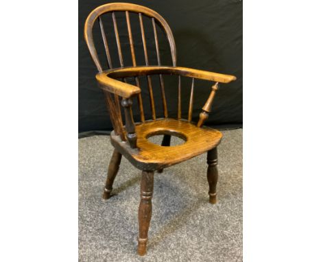 An early 19th century child's, oak and elm, commode Windsor chair, c.1800. 