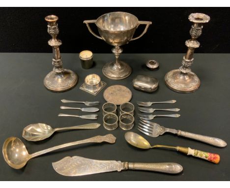 A late 19th century EPBM two handled trophy cup;  a pair of Sheffield Plate candlesticks;  EPNS fish servers; Kings pattern l