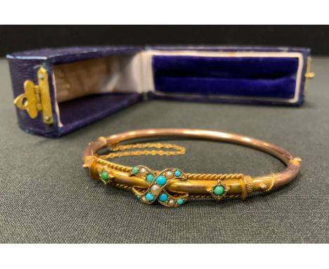 An early 20th century rose coloured metal turquoise inset hollow bar hinge bangle, unmarked, 7g gross, fitted case 