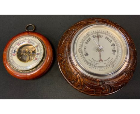 A carved oak framed aneroid barometer, another smaller plain (2) 