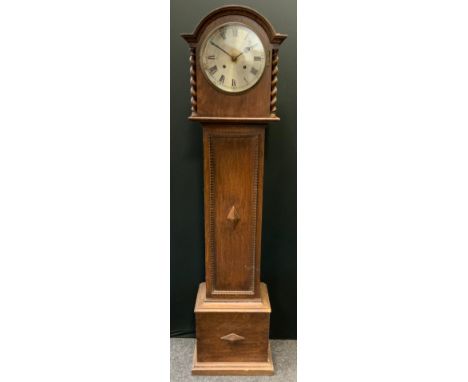 An early 20th century oak cased longcase clock of small proportions, circular face, roman numerals, twin winding holes, 139cm