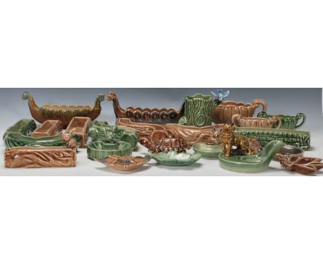 A collection of&nbsp;vintage 20th century Wade ceramics to include a green glazed pipe holder having an Alsatian, tree trunk 