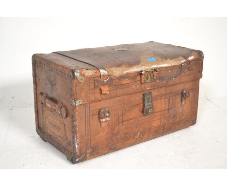 A 19th Century brown leather carriage travel trunk having a brass cartouche panel to the lid inscribed Captain Moss, opening 