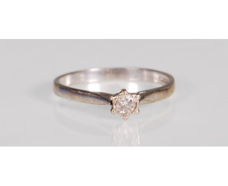 An English hallmarked 18ct white gold and diamond solitaire ring prong set with a brilliant cut diamond. Hallmarked Sheffield