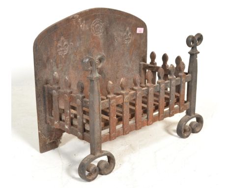 A late 19th Century Victorian cast iron fire grate&nbsp;with decorative fleur-de-lys detailing and scroll finials and feet ha