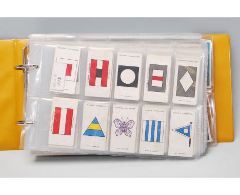 An album of vintage Player and Sons cigarette cards to include mostly full sets; Army Corps and Divisional Signs, War Decorat