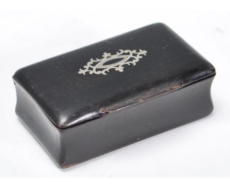 A 19th Century Victorian ebony snuff box of rectangular form having silver inlaid decoration atop the hinged lid. Measures 2c