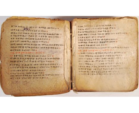 An incredible rare 19th century Ethiopian prayer book manuscript - hand written in coptic language in red and black, with occ