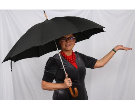 A c1920s-30s rare collapsable full-size black umbrella with wooden handle and chrome coloured shaft and spokes. Italian made 