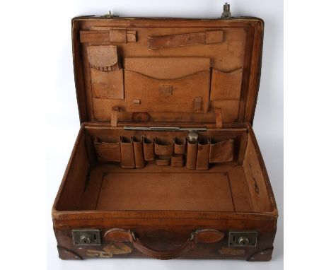 Two good quality antique leather suitcases complete with luggage labels. One is leather lined with compartments with one chro