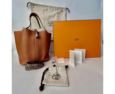 HERMES Taurillon Clemence Picotin lock 22 handbag in fauve/gold (brown) leather. "Picotin is a nod to the equestrian world. I