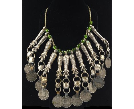 Costume jewellery. A twelve-strand Afghanistan silver coin Turkoman Kuchi fish amulet with green glass beads  Condition Repor
