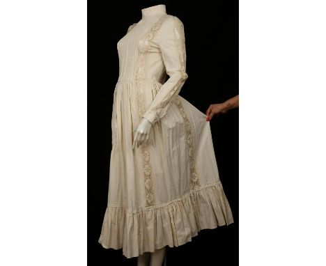 LAURA ASHLEY. A vintage plain calico cotton prairie dress with monochrome label "MADE IN WALES" with ornate lace panels and m