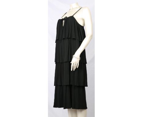 ROLAND KLEIN A rare early 1970s soft crepe tiered "Little Black Dress" made in England by Marcel Fenez. Fits modern UK 10-12(