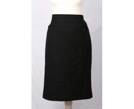 Addendum description - CHANEL BOUTIQUE A classic silk-lined fine black wool pencil skirt with hip pockets with CHANEL buttons