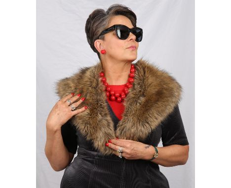 A collection of vintage fur stoles to include a 1930s arctic blue fox stole with paws, a 1950s Canadian red squirrel stole an