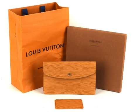 LOUIS VUITTON A vintage Montaigne pochette case in yellow (tan) leather (9" x 6") with matching business-card case (4.5" x 3"