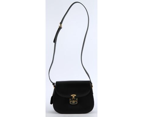 GUCCI. A 1980s boxed black cross-body handbag with gold coloured hardware GCH and lipstick red leather lining. With dust bag 