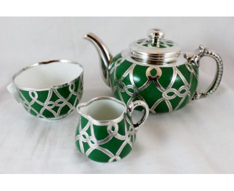 Royal Worcester three piece bachelor tea service with hallmarked silver lattice work, assay Birmingham 1910 