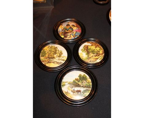 Four Prattware ceramic lids with wooden mounts