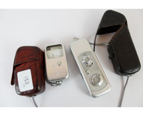 German sub mini Minox spy camera in leather case with measuring chain and a Minox 6 light meter in leather case