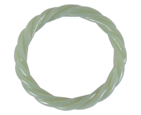 A Chinese jade bangleOf a deep celadon tone. Finely carved as a torchon bracelet.D 7.5 cm CONDITION REPORT: A well carved pie