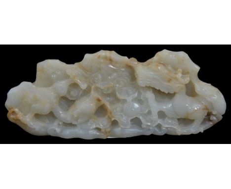 A Chinese jade boulderPossibly 19th/early 20th centuryOf a pale celadon tone with light brown streaks. Carved in the shape of