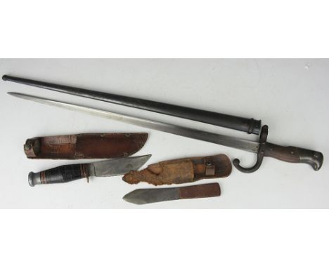 An 1877 pattern French bayonet, in scabbard, with a William Rogers knife, the blade stamped 'I cut my Way', with scabbard, an