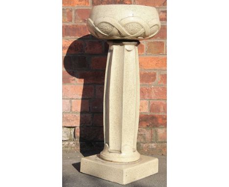An Archibald Knox for Liberty & Co stoneware jardiniere, the bowl cast with celtic knot motifs upon an octagonal column, on s
