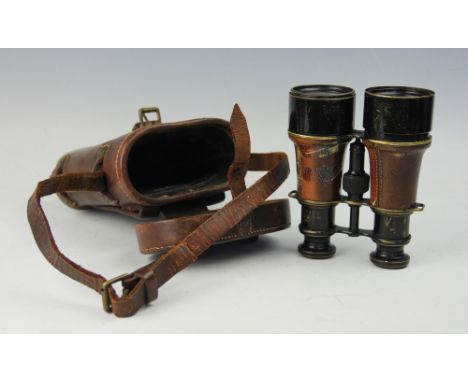 A pair of WWI military binoculars, the black lacquered binoculars with military arrow head and 'Mk V Wide 42889', in original