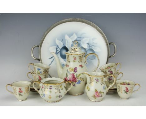A Bavarian fifteen piece coffee service, with floral detailing, with a gallery ceramic tray decorated with plums, 28cm diamet