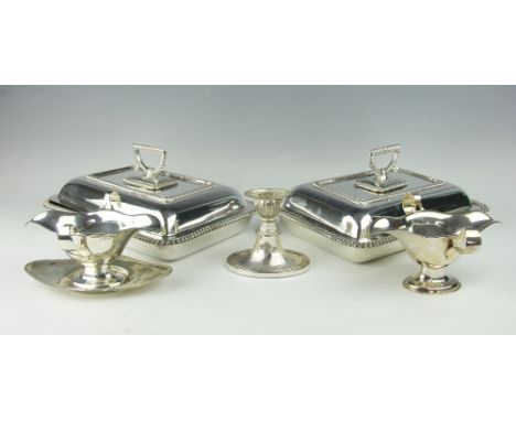 A selection of silver comprising; a twin handled sauce boat and stand, Levi & Salaman, Birmingham 1909, along with a similar 
