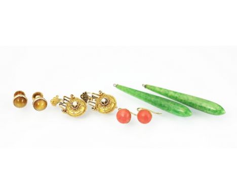 A selection of earrings, to include; a pair of jade coloured drops (lacking fittings) 5cm long, a pair of coral set stud earr