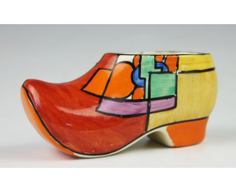 A Clarice Cliff clog or sabot, circa 1930, brightly decorated in primary colours with a bold design similar to the, Picasso F