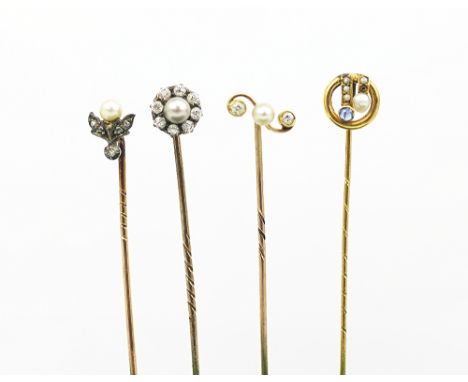 Four pearl and diamond set stick pins, to include; a circular cluster set example, a stylised floral example, an Art Deco exa