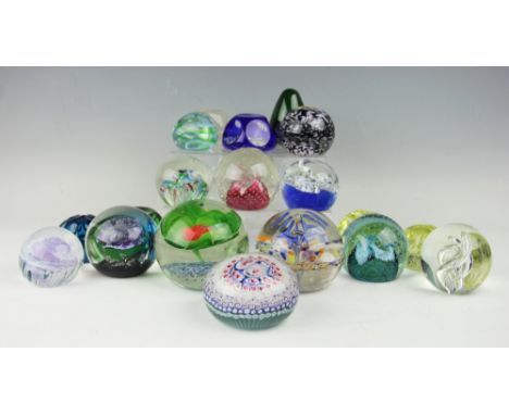A collection of nineteen glass paper weights including four Caithness examples, a Langham example, a mille fiori example, and