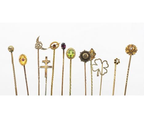 Twelve assorted stick pins, to include; garnet, pearl, peridot, diamond and other stone set examples, all set in yellow metal