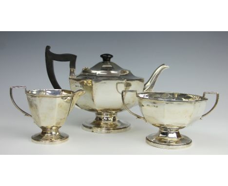 A silver three piece tea service, A L Davenport Ltd, Birmingham 1937, each of plain hexagonal form on pedestal type bases, 26