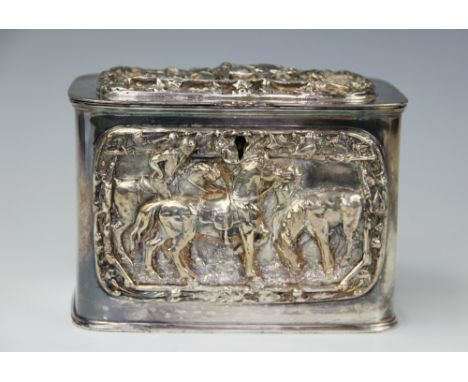 A Victorian silver plated tea caddy or casket, of rounded rectangular form, the cover and front cast with horses, hounds and 