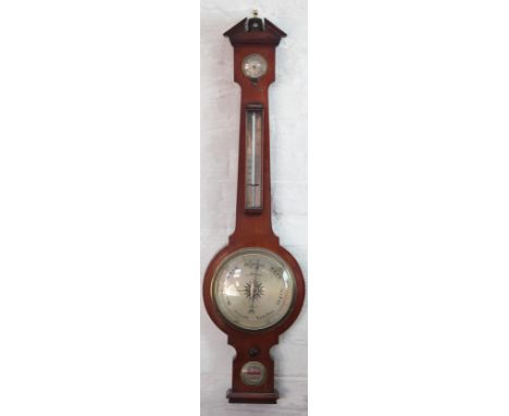 A Negretti & Zambra mahogany wheel barometer, with silvered dial, thermometer and spirit level, 97cm