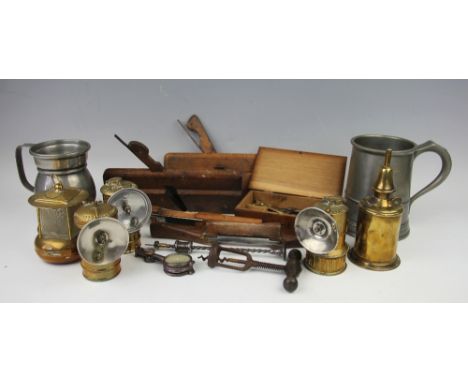 A selection of vintage items to include; a Premier brass carbide lamp, two other carbide lamps, a French Pigeon lamp, a brass