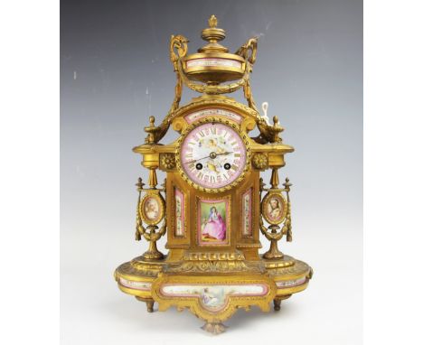A 19th century French ormolu and Sevres style porcelain mounted eight day mantel clock, the porcelain dial with gilt Roman nu
