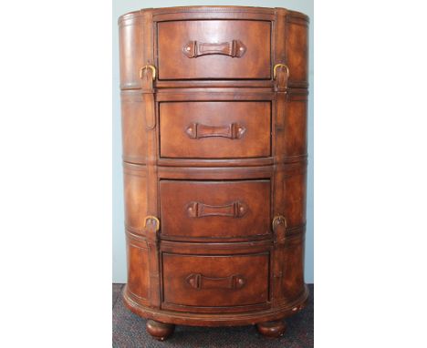 A vintage style tan leather oval chest of four short drawers, on bun feet, 100cm H x 61cm W