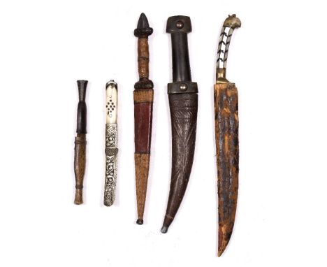 Five daggers comprising of an Indo-Persian example, with mother of pearl handle, three daggers with wooden handles and an ivo