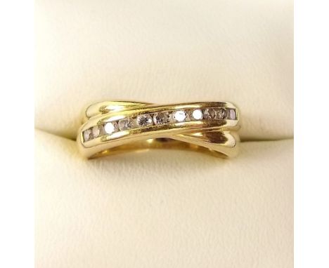 An 18ct gold modern ring channel set diamonds 