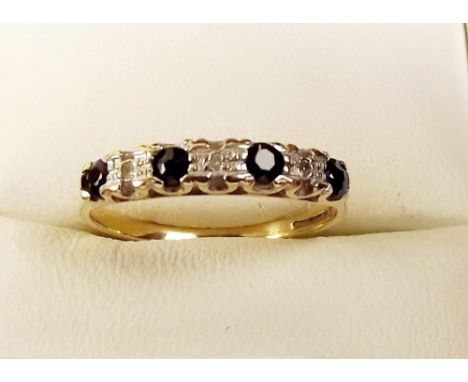 A 9ct gold sapphire and chip diamond ring 