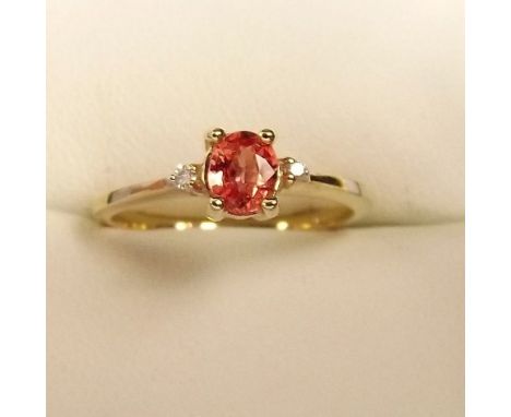 A 9ct gold ring set Padparadscha sapphire 