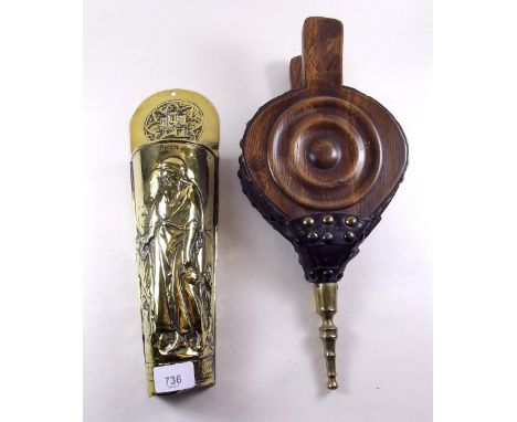 A brass taper stick holder and a pair of old bellows