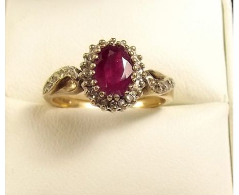 A 9ct gold ruby and diamond cluster ring 