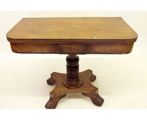 A Victorian mahogany fold top card table on turned column and quadruple base 